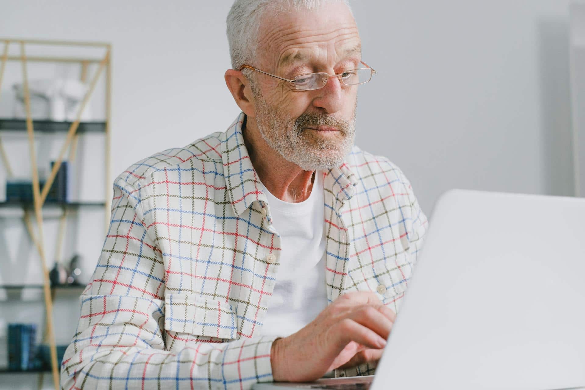 Old man working on laptop