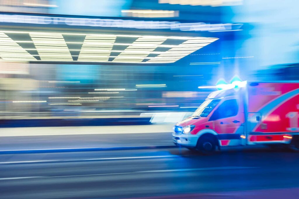 Red emergency vehicle in timelapse photography
