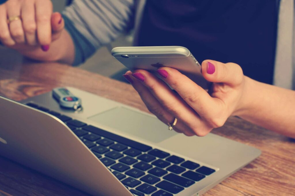 Woman holding a silver iPhone 6